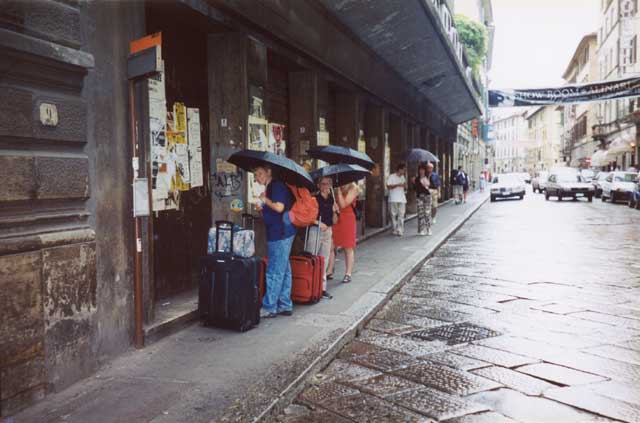 Walking to the terminal in the rain, Florence, Italy