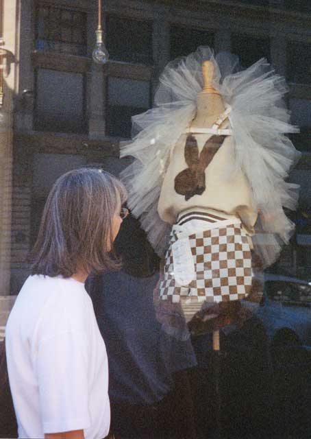 Susan McQueen with Playboy logo